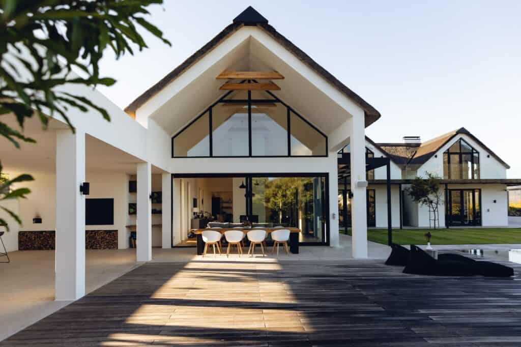 view-of-luxurious-modern-house-exterior-with-dining-space-and-garden-1024x682