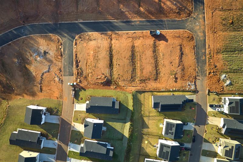 aerial-view-of-construction-site-with-new-tightly-2024-12-06-03-27-37-utc